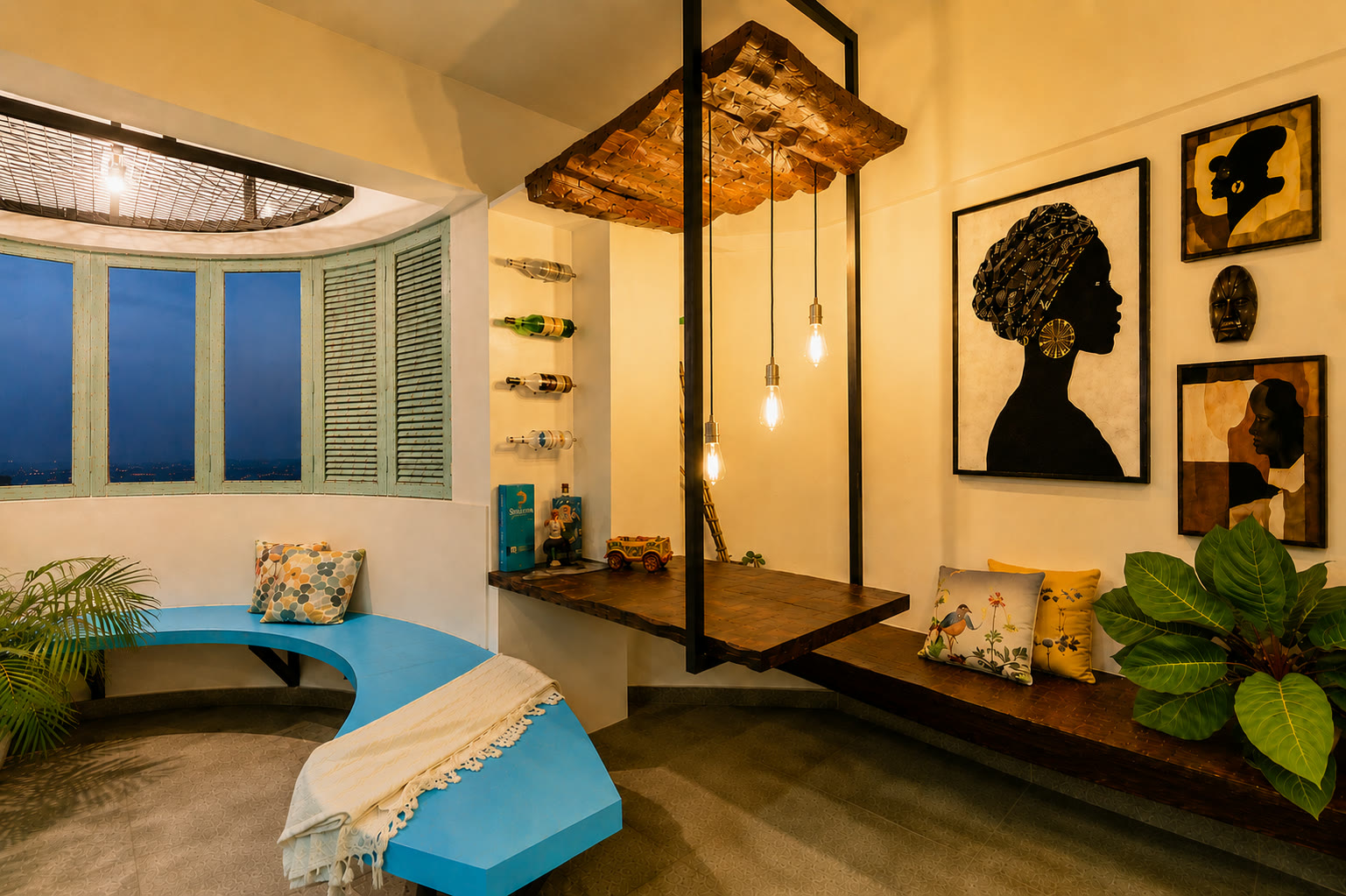 Ashcroft living room with blue seating, artwork, and black metal screens