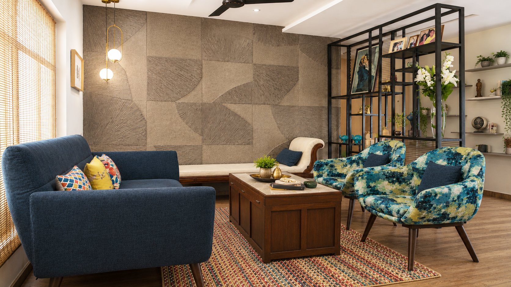Blue sofa and abstract-patterned armchairs facing a textured geometric feature wall