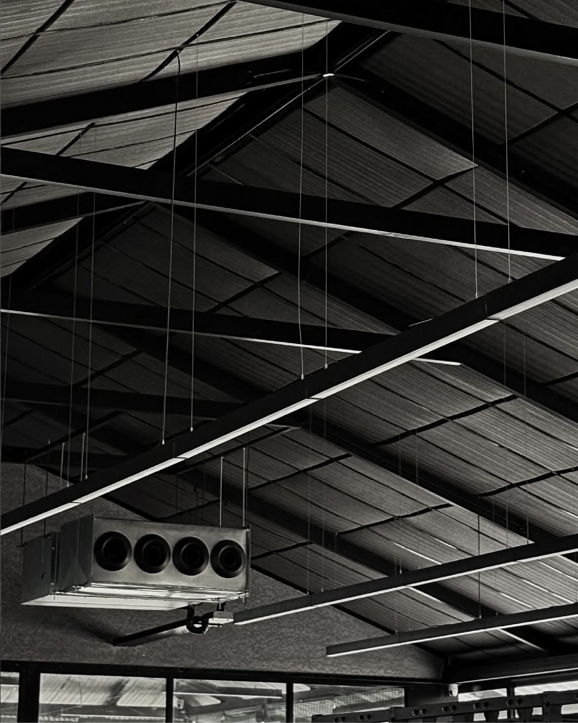 Linear ceiling lights across the dark industrial interior of LIFT Studio
