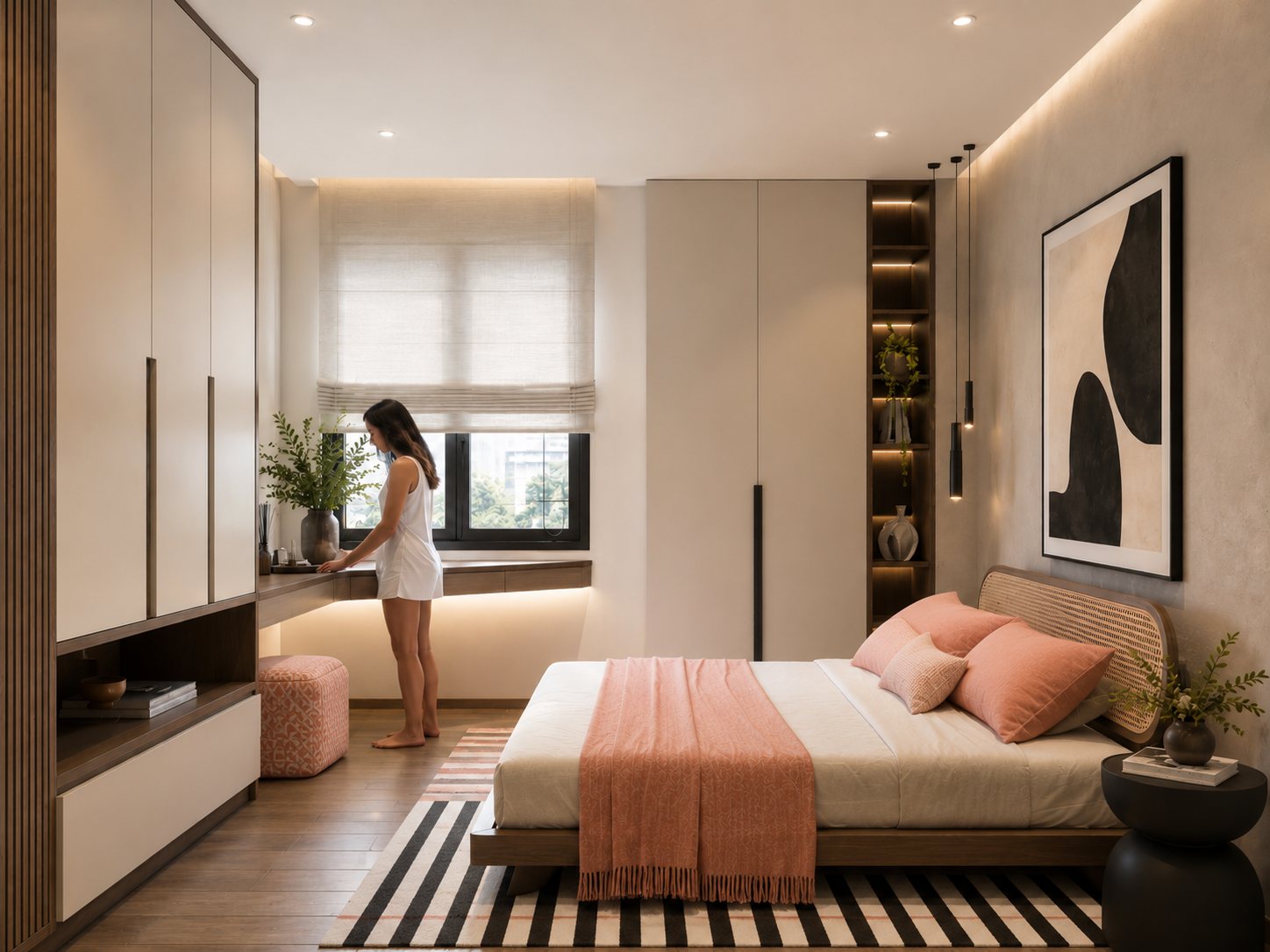 Bedroom with coral bedding, full-height wardrobes and a woman standing at the window