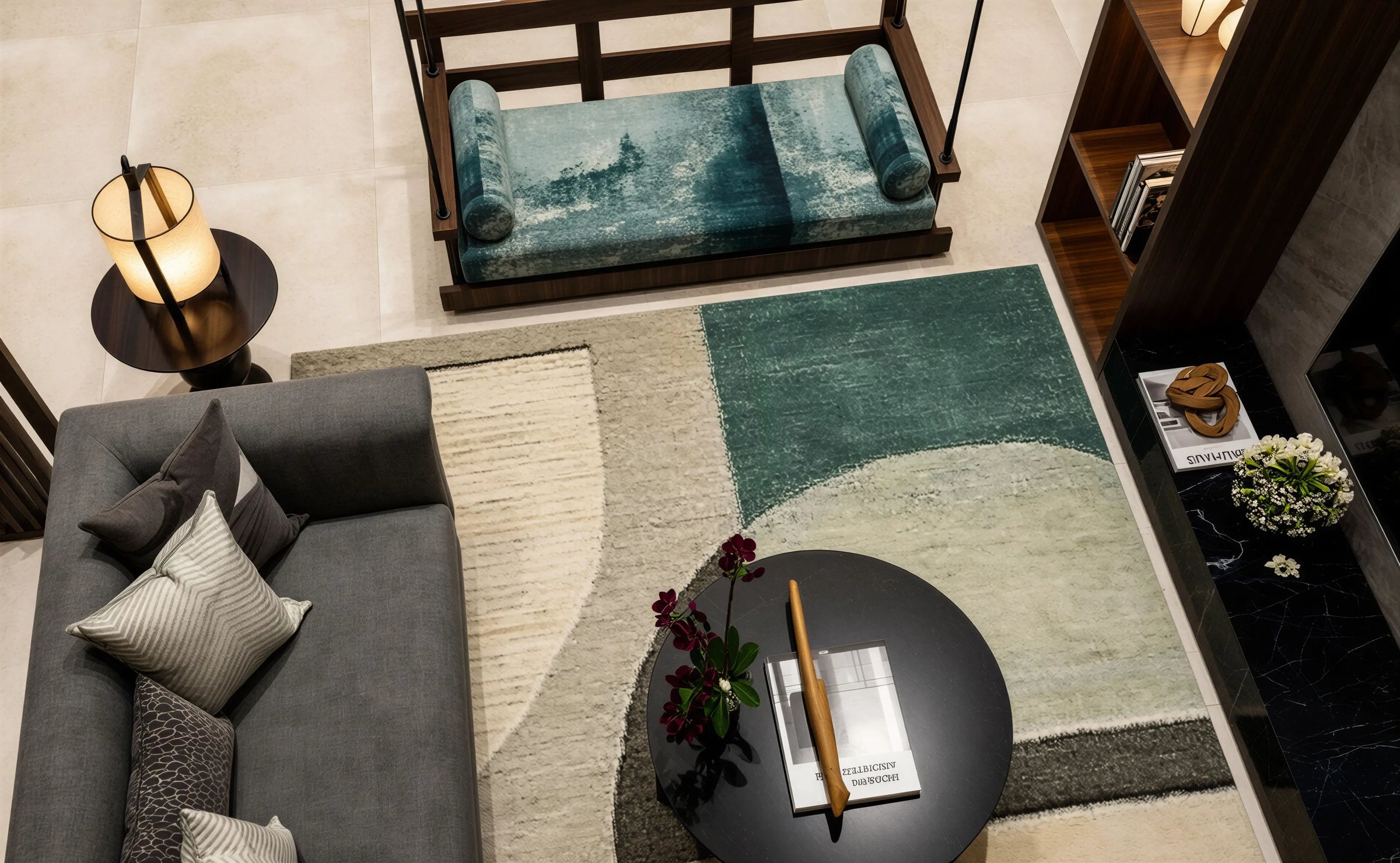 Top-down living-room view with a teal-cushioned swing, gray sofa and geometric green rug
